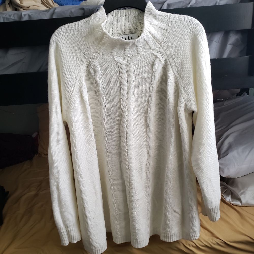 Knitted white sweater turtleneck